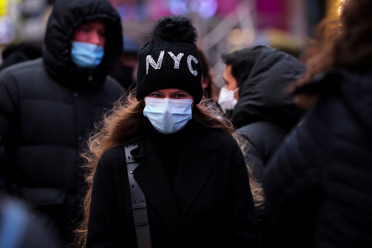 A person waits in a queue for a coronavirus disease (COVID-19) test in Times Square in Manhattan, New York City