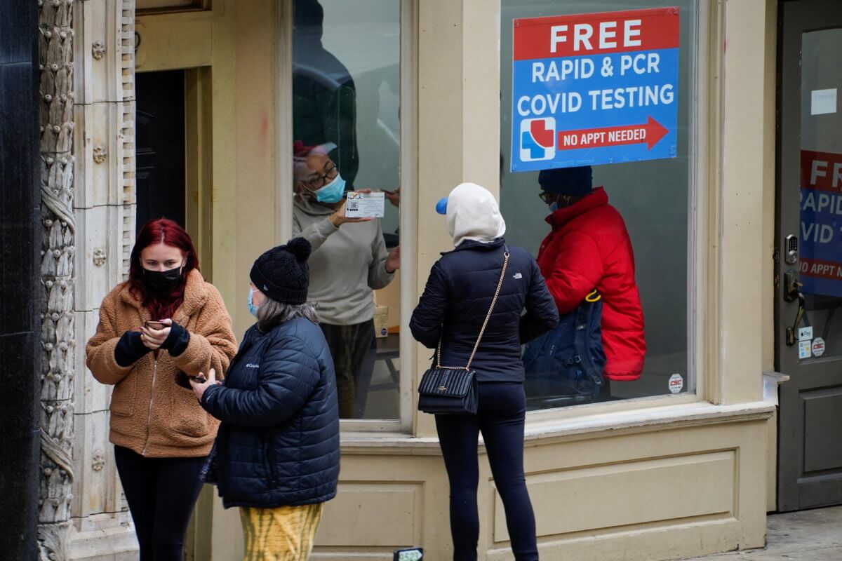 A person receives the results of a coronavirus disease (COVID-19) test through a window, in Indianapolis