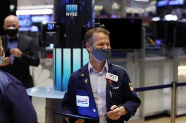 A trader works on the trading floor at the New York Stock Exchange (NYSE) in Manhattan