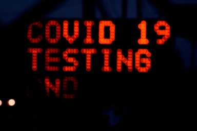 FILE PHOTO: Long lines for COVID-19 testing form at Indianapolis Motor Speedway
