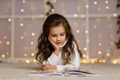 child girl is reading book