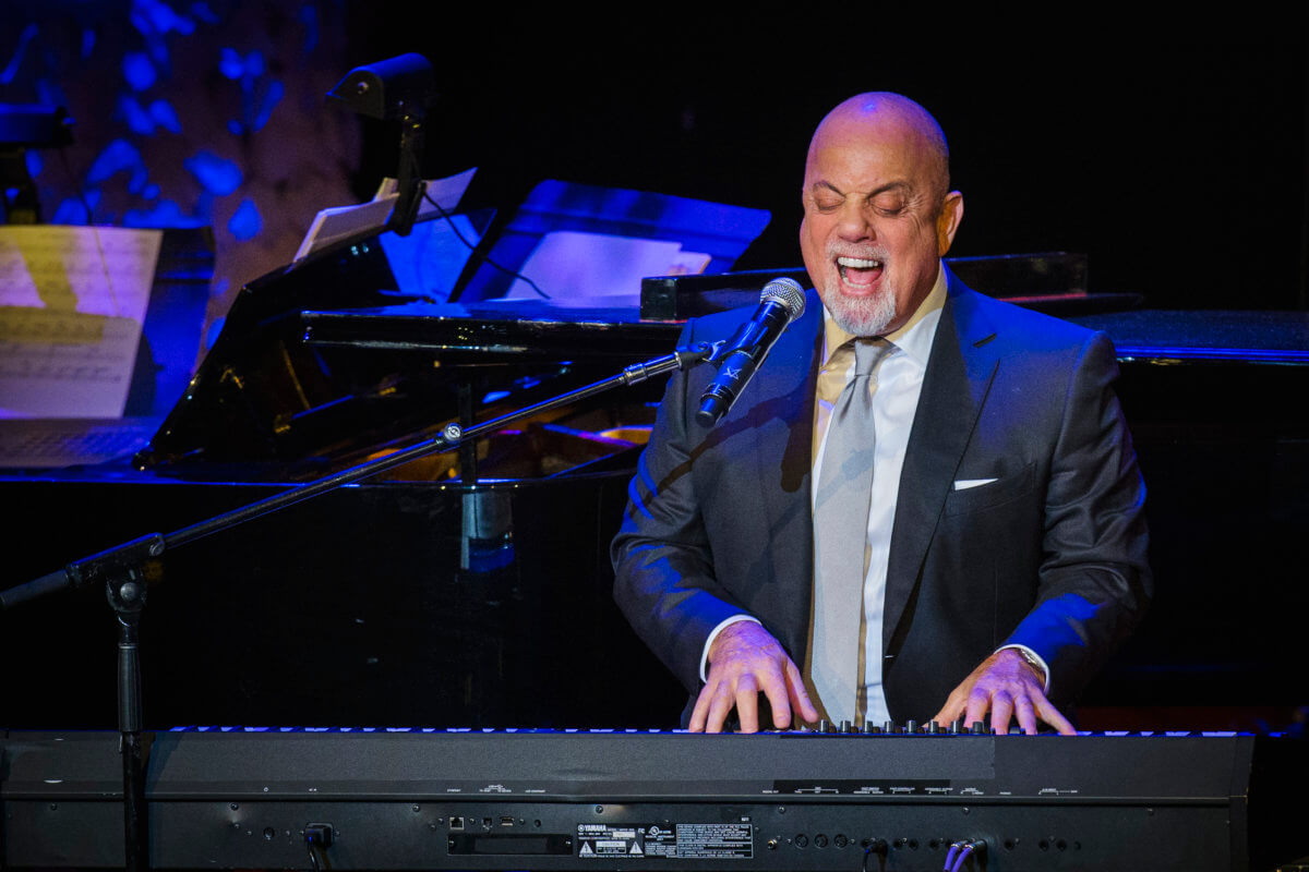 Billy Joel performs after accepting an award at the American Society of Composers, Authors and Publishers Centennial Awards in New York