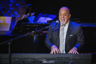 Billy Joel performs after accepting an award at the American Society of Composers, Authors and Publishers Centennial Awards in New York