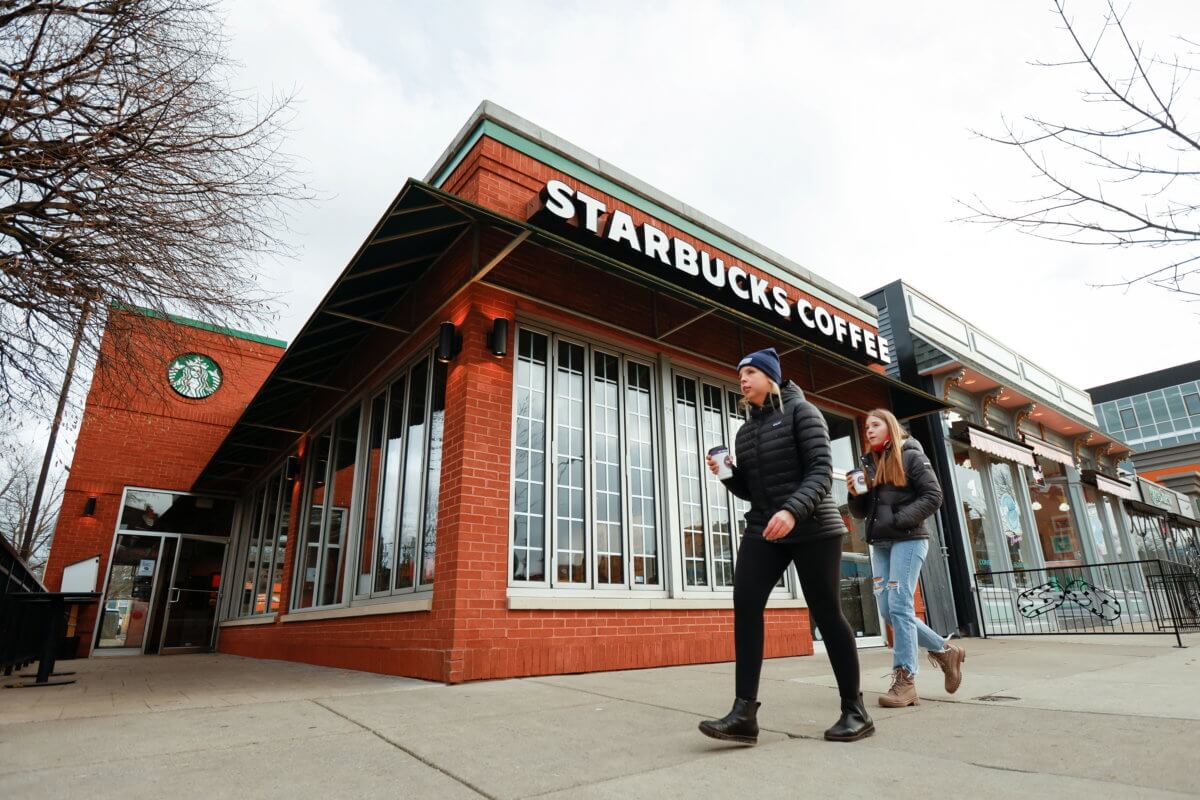 People walk past a Starbucks in Buffalo, New York