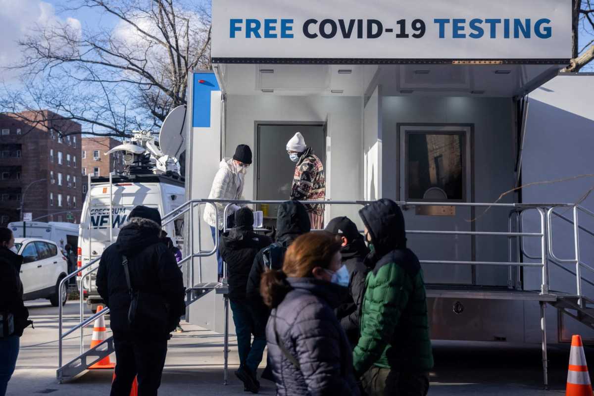 People queue at a popup COVID-19 testing site in New York