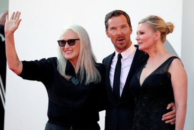 FILE PHOTO: The 78th Venice Film Festival – Screening of the film ‘The Power of the Dog’ in competition – Director Jane Campion, actor Benedict Cumberbatch and actor Kirsten Dunst pose