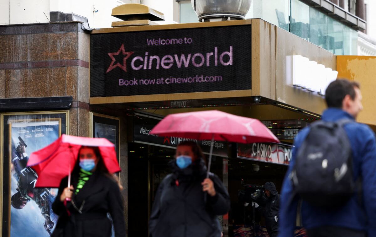 FILE PHOTO: People walk past a Cineworld in Leicester’s Square in London