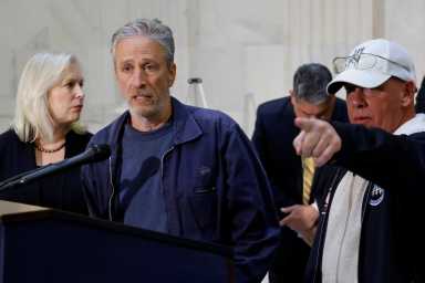Jon Stewart, with U.S. Sen. Gillibrand and activist Feal, speaks to reporters about their effort to raise awareness for U.S. veterans suffering from military toxic exposures, on Capitol Hill in Washington