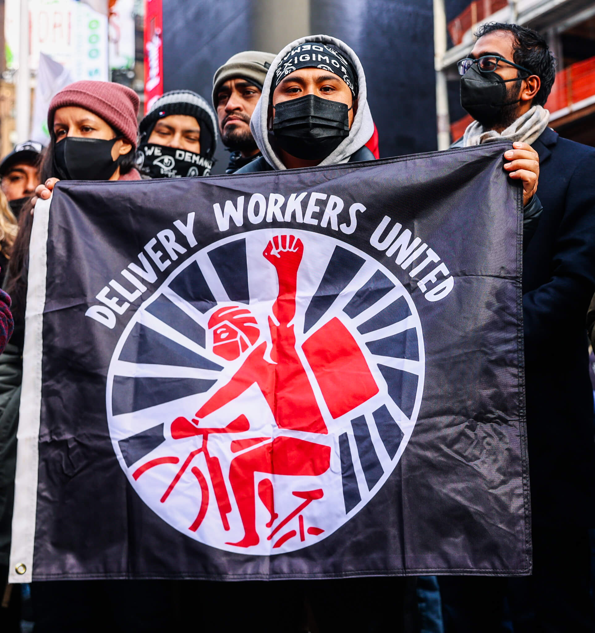 Delivery workers, advocates celebrate in Times Square new labor rights taking effect Monday 5