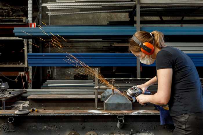 Female Tradesperson In Workshop