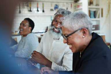 Man enjoying Christmas party with friends at home