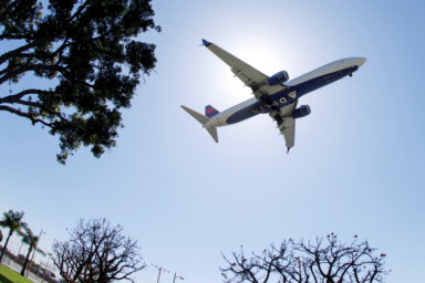 FILE PHOTO: A Delta Airlines passenger jet approaches to land at LAX in Los Angeles