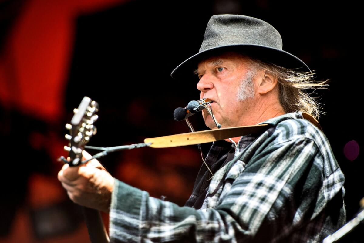 FILE PHOTO: Neil Young takes aim at Spotify CEO, big banks