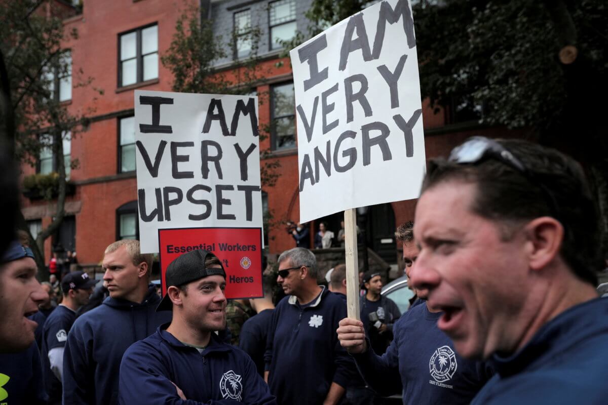 FILE PHOTO: Union firefighters and others protest against mandated vaccines in New York City