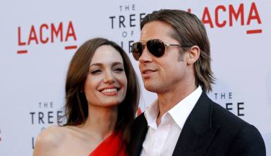 FILE PHOTO: Pitt and Jolie pose at the premiere of “The Tree of Life” at LACMA in Los Angeles