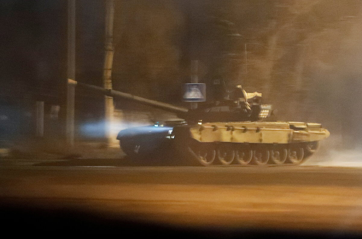 A tank drives along a street in Donetsk
