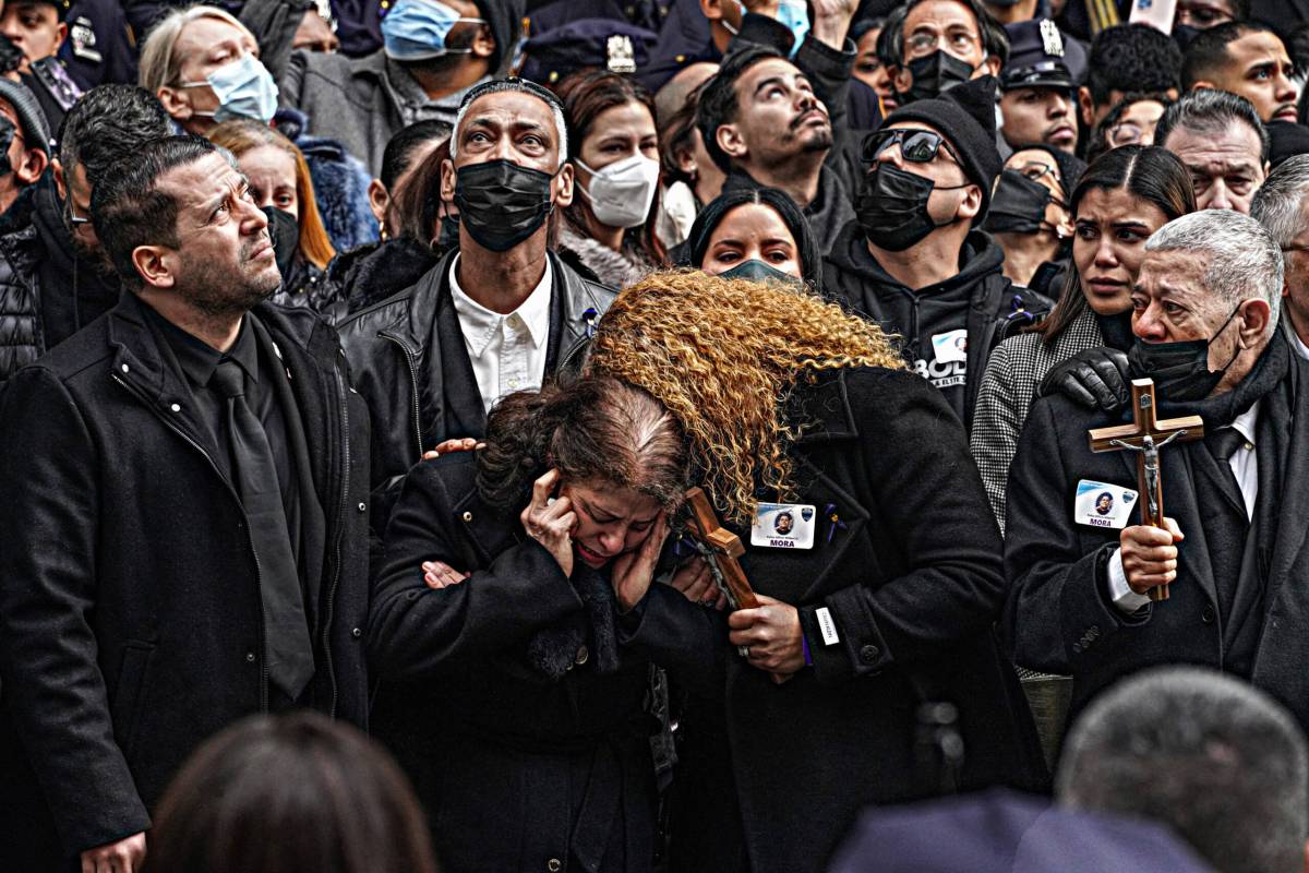 Wilbert Mora's mother breaks down and clutches her skull as anguish consumes her