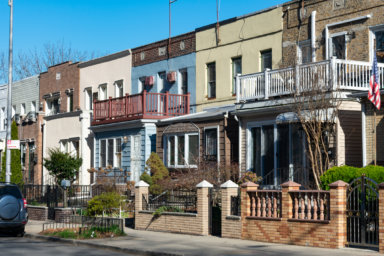 A Row of Beautiful Old Homes along the Sidewalk in Astoria Queens New York