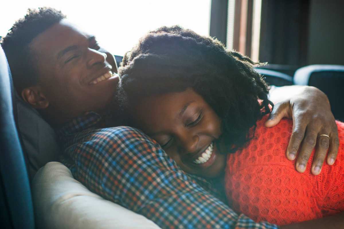 Young couple relaxing on sofa at home