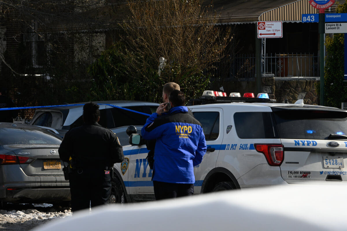 Police from the 1 Precinct investigate a shooting at 568 Empire Blvd.