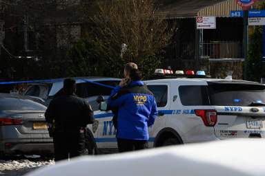 Police from the 1 Precinct investigate a shooting at 568 Empire Blvd.