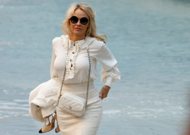 Pamela Anderson arrives to attend the Chanel Spring/Summer 2019 women’s ready-to-wear collection show at the Grand Palais transformed as a beach scene during Paris Fashion Week