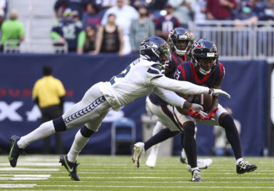Former Seahawks cornerback D.J. Reed, who has agreed to sign with the Jets, defends a pass intended for Houston Texans wide receiver Brandin Cooks.