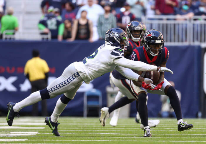 Former Seahawks cornerback D.J. Reed, who has agreed to sign with the Jets, defends a pass intended for Houston Texans wide receiver Brandin Cooks.