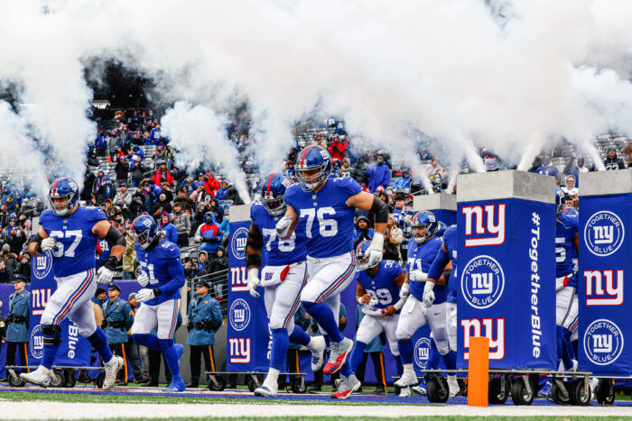 New York Giants run onto the field for a game against Washington on Jan. 9.