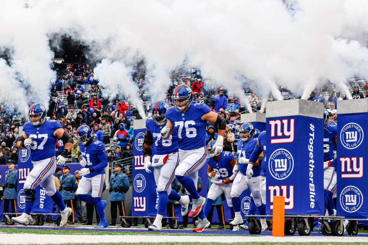 New York Giants run onto the field for a game against Washington on Jan. 9.