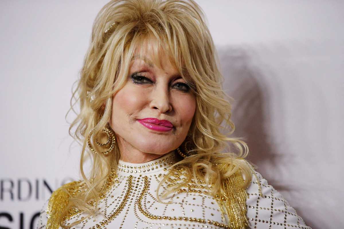 FILE PHOTO: Dolly Parton attends a red carpet gala event honoring her as the MusiCares person of the year in Los Angeles