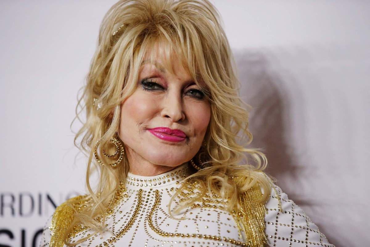 FILE PHOTO: Dolly Parton attends a red carpet gala event honoring her as the MusiCares person of the year in Los Angeles