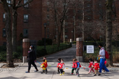 Children are seen walking, on the first day of lifting the indoor mask mandate for DOE schools between K through 12, in Manhattan, New York City