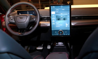 FILE PHOTO: Ford Motor Co’s next generation SYNC 4 communications and entertainment system on a 15.5″ touchscreen display screen is seen in the interior of Ford’s all-new electric Mustang Mach-E vehicle at a studio in Warren, Michigan