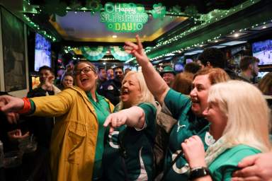 People sing at The Perfect Pint, an Irish bar, in the Manhattan borough of New York City