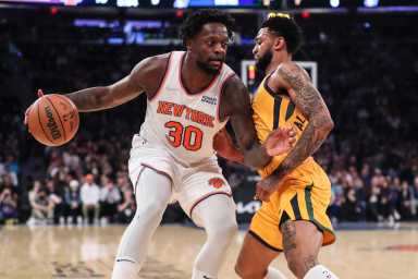 Knicks forward Julius Randle is defended by Utah Jazz guard Nickeil Alexander-Walker.