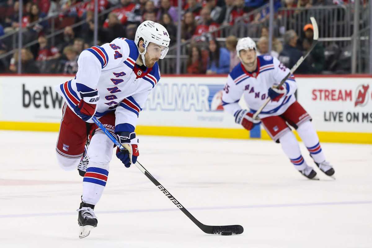 Rangers center Tyler Motte shoots the puck against New Jersey Devils.