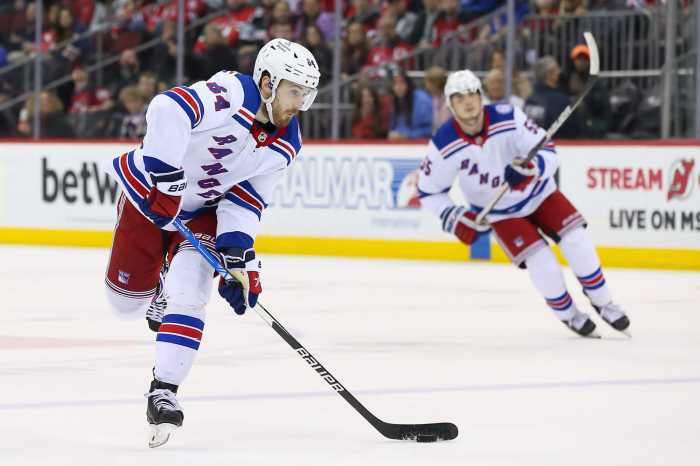 Rangers center Tyler Motte shoots the puck against New Jersey Devils.