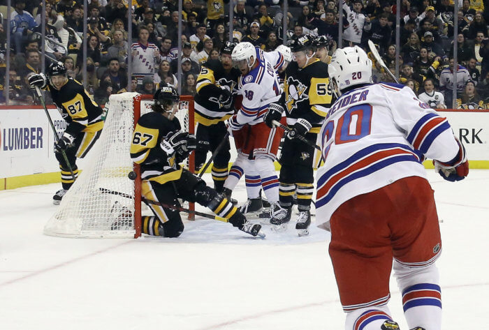 Rangers left wing Chris Kreider shoots on net against the Penguins.