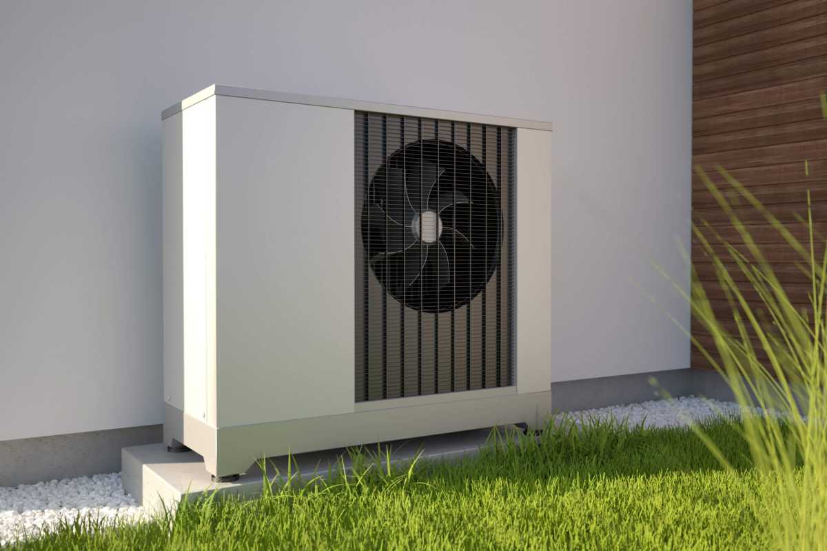 Air heat pumps beside house