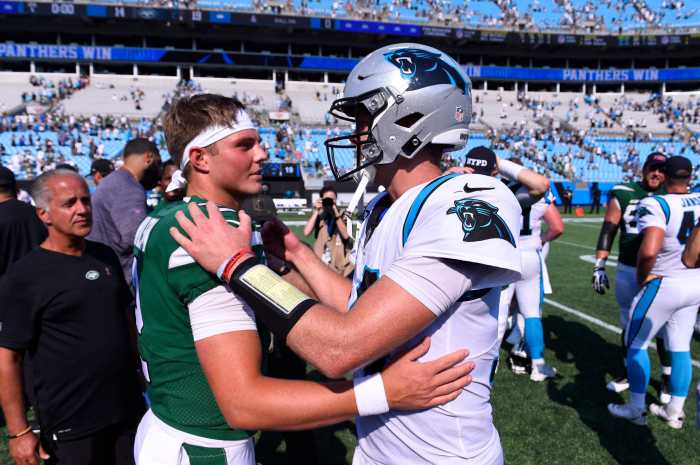 Jets quarterback Zach Wilson with former Jets passer Sam Darnold.