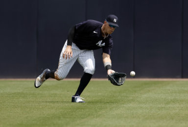 Yankees right fielder Aaron Judge fields a ball during the fourth inning against the Philadelphia Phillies during spring training.