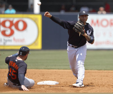 Yankees second baseman Gleyber Torres forces out Detroit Tigers catcher Tucker Barnhart.