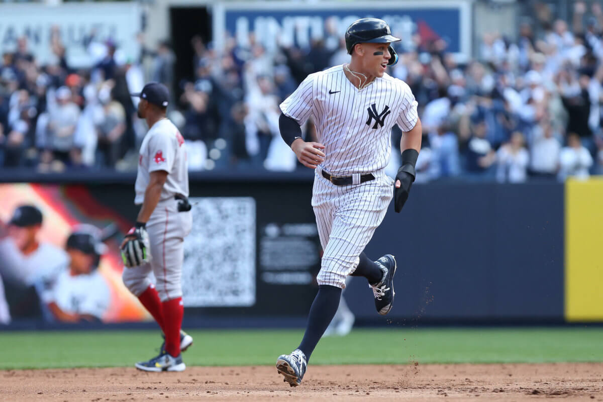Yankees right fielder Aaron Judge reacts to a home run by New York Yankees first baseman Anthony Rizzo against Boston Red Sox .