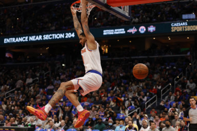 Knicks forward Obi Toppin dunks the ball against the Washington Wizards.