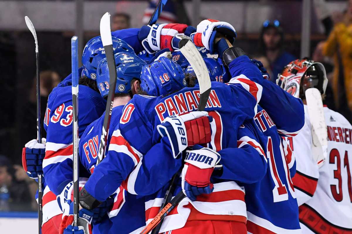 Rangers players celebrate the 50th goal of the season by left wing Chris Kreider.