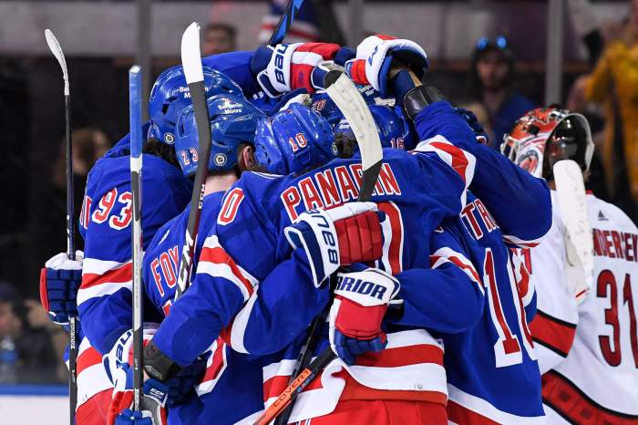Rangers players celebrate the 50th goal of the season by left wing Chris Kreider.