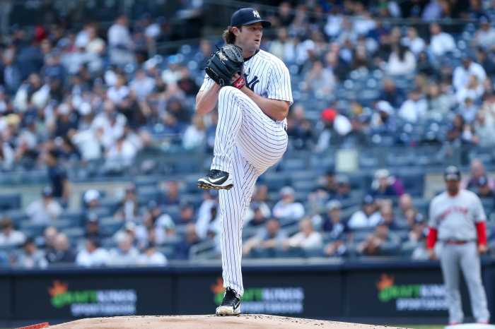 Yankees ace Gerrit Cole pitches a ball.