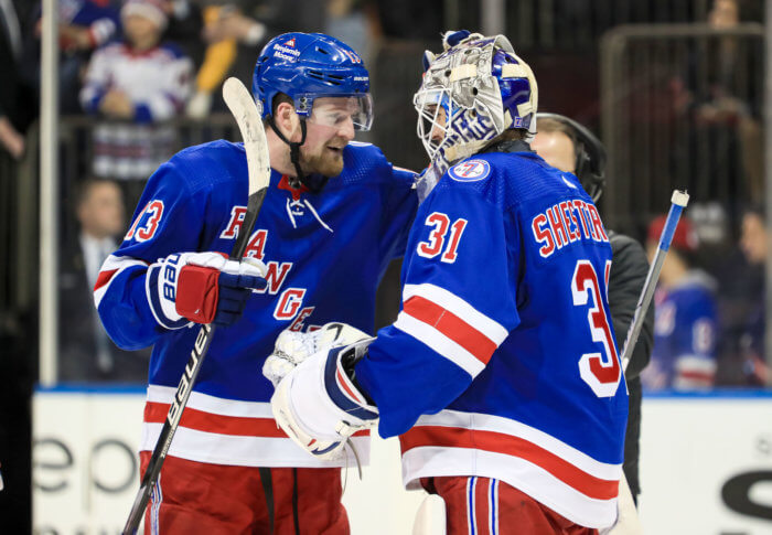 Rangers left wing Alexis Lafreniere celebrates a 4-0 win against the Detroit Red Wings with goalie Igor Shesterkin.