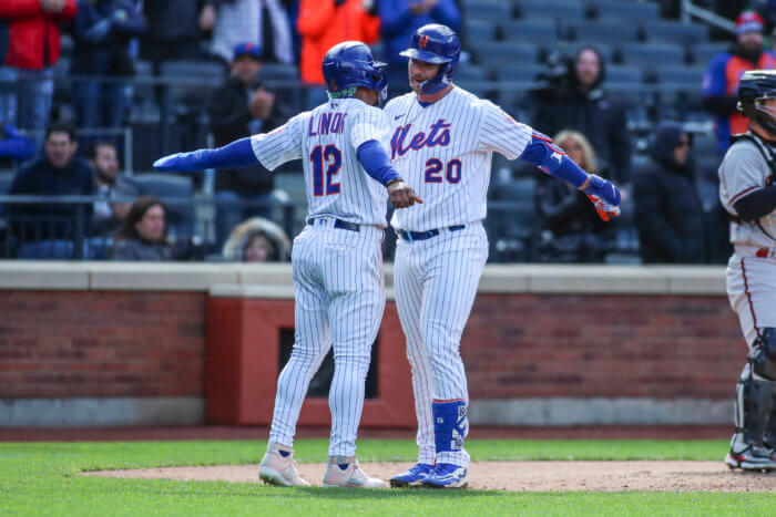 Mets designated hitter Pete Alonso is greeted by shortstop Francisco Lindor after hitting a two-run home run.